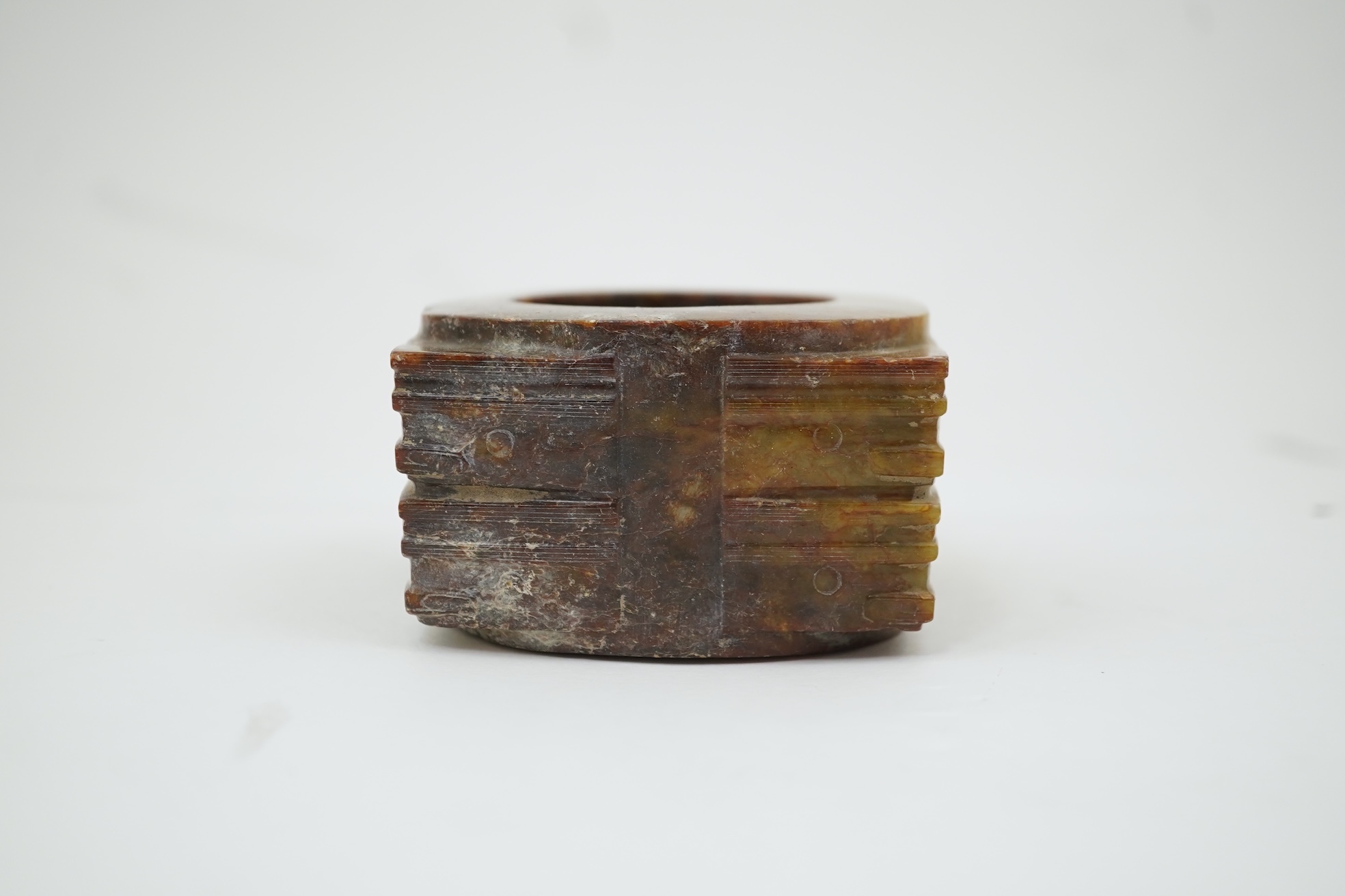Four Chinese archaistic hardstone or burnt jade cong or cylinders